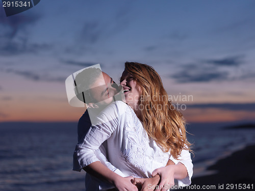 Image of young couple  on beach have fun