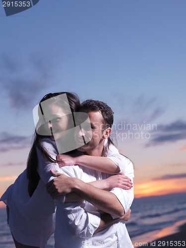 Image of young couple  on beach have fun