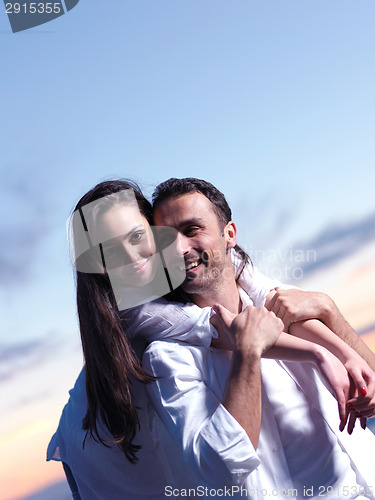 Image of young couple  on beach have fun