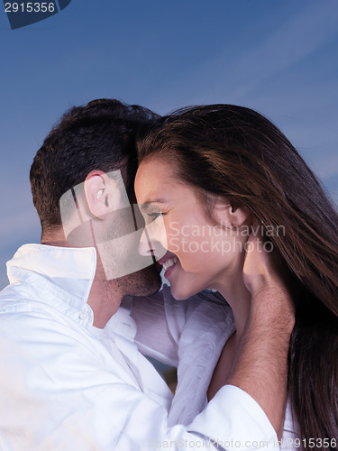 Image of young couple  on beach have fun