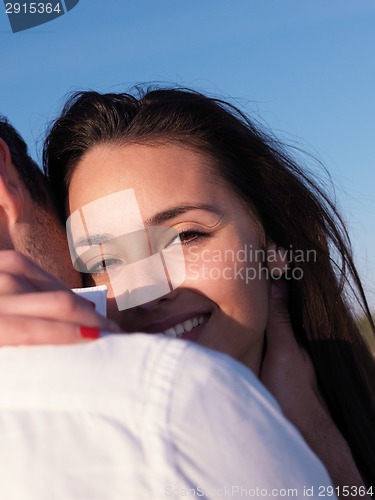 Image of young couple  on beach have fun