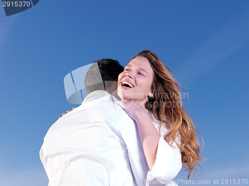Image of young couple  on beach have fun