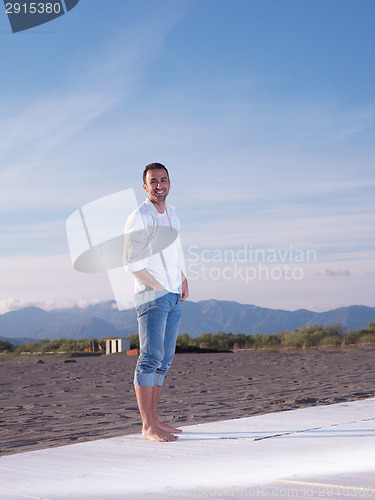 Image of young couple  on beach have fun
