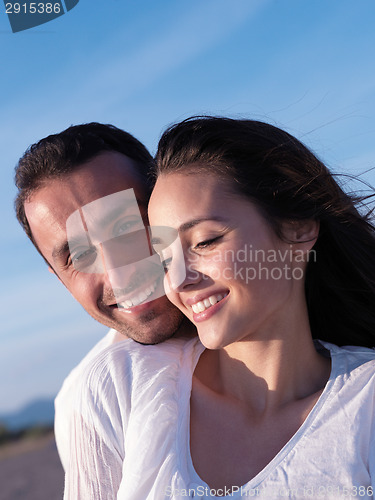 Image of young couple  on beach have fun