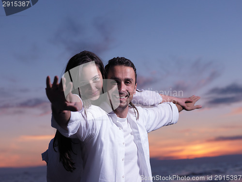 Image of young couple  on beach have fun
