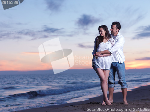 Image of young couple  on beach have fun