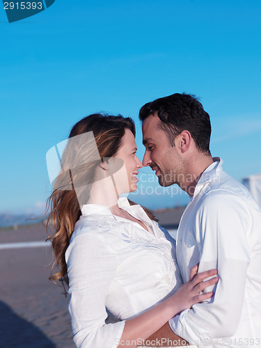 Image of young couple  on beach have fun