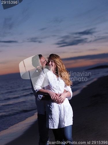 Image of young couple  on beach have fun