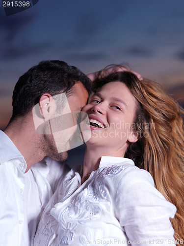 Image of young couple  on beach have fun