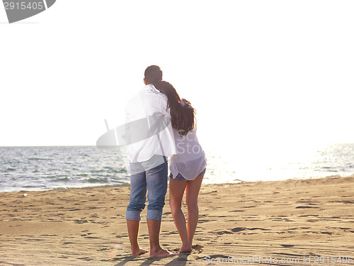 Image of young couple  on beach have fun