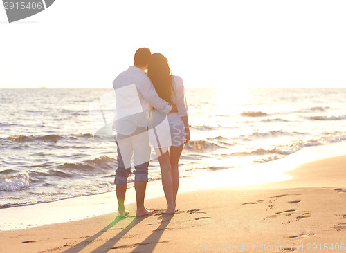Image of young couple  on beach have fun