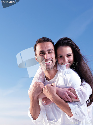 Image of young couple  on beach have fun