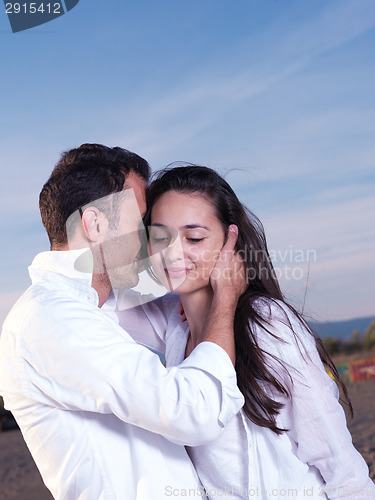 Image of young couple  on beach have fun