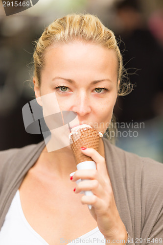 Image of Lady licking icecream.