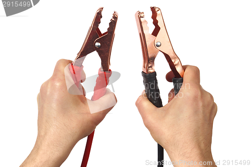 Image of Hands with jumper cables on white