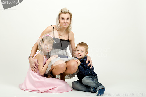 Image of Studio portrait of siblings beautiful boy and girl and mother