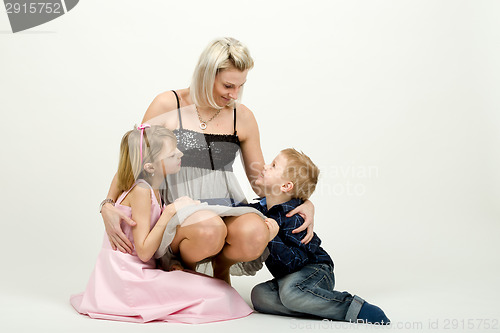 Image of Studio portrait of siblings beautiful boy and girl and mother