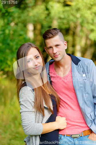 Image of Happy smiling young couple outdoor