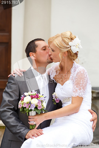 Image of beautiful young wedding couple kissing