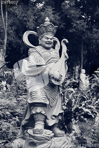 Image of Aged asian god statue