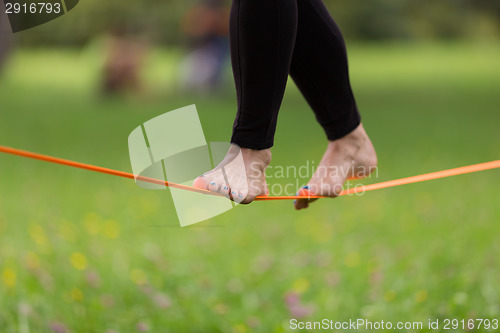 Image of Slack line in the city park.