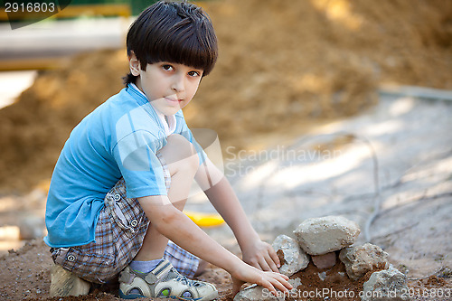 Image of boy builds a house