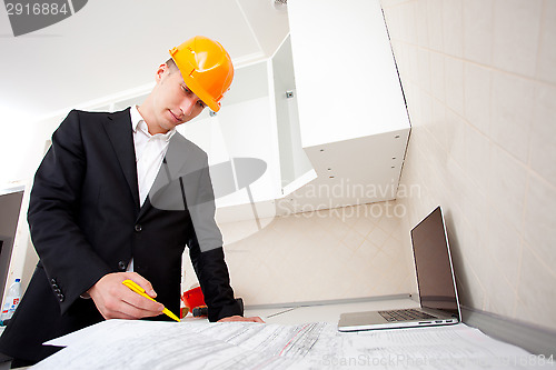 Image of foreman with blueprints