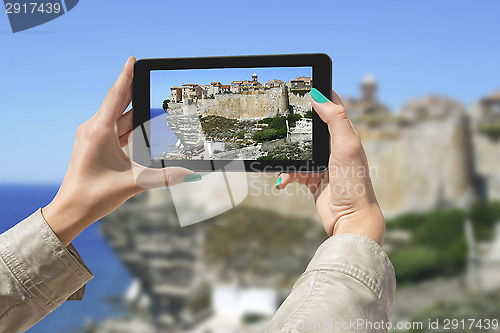 Image of Photographing Bonifacio with tablet