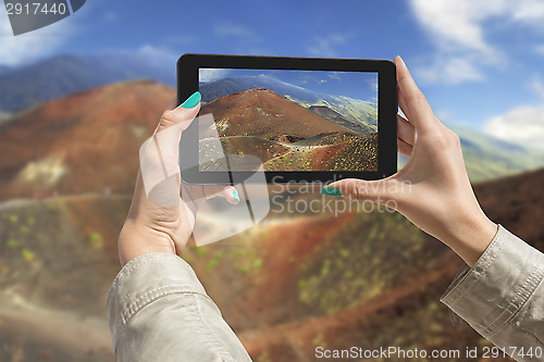 Image of Photographing Etna volcano with tablet