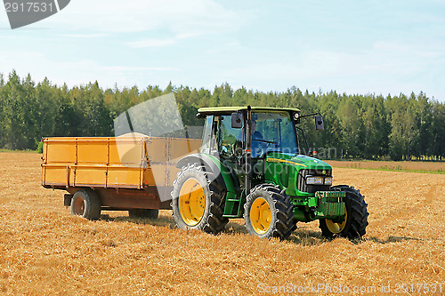 Image of Farmer Driving John Deere 5820 Tractor and Trailer 