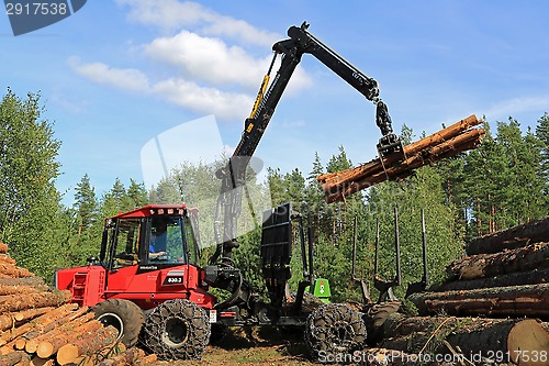 Image of Operator Stacking up Logs with Komatsu 830.3 Forestry Forwarder