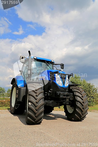 Image of New Holland T7.185 Agricultural Tractor on Display, Vertical Vie