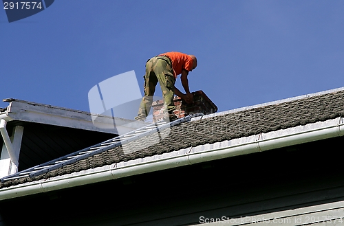 Image of Man on a roof