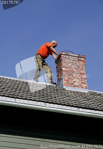Image of Man on a roof