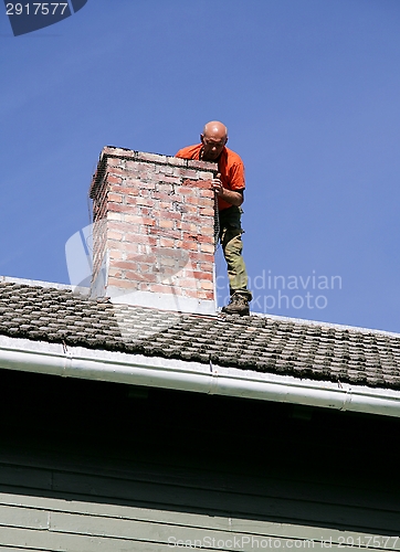 Image of Man on a roof