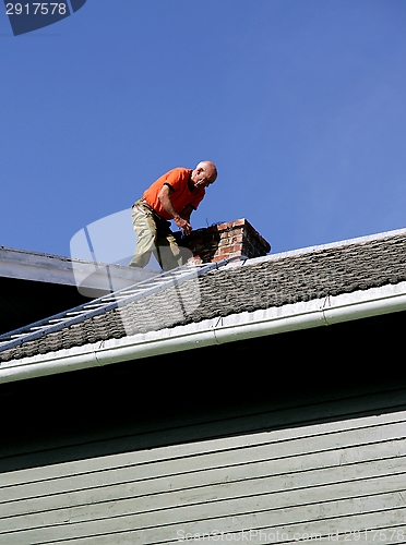 Image of Man on a roof