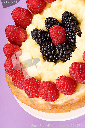 Image of Custard tart with raspberries and blackberries