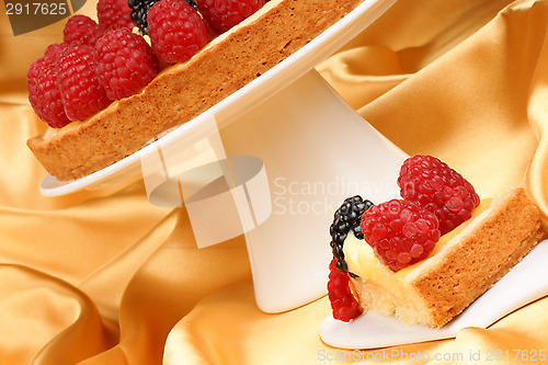 Image of Custard tart with raspberries and blackberries