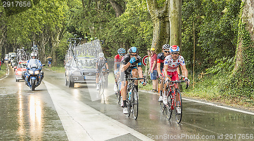 Image of Group of Cyclists in a Rainy Day