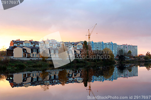 Image of landscape with river and modern house