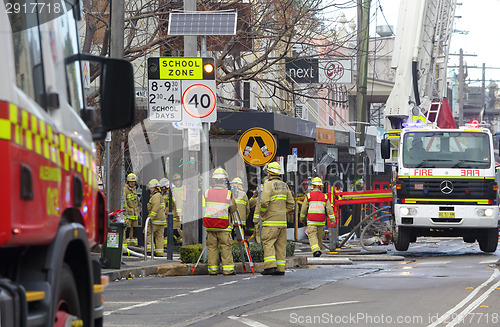 Image of Fire crew and engineers at work at site of explosion