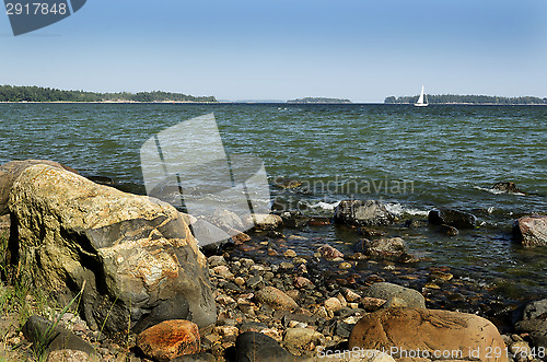 Image of Finland, Baltic sea coast, sailboat on the horizon