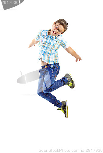 Image of little boy jumping on white background