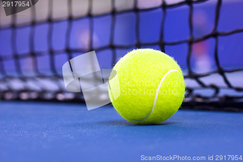 Image of tennis ball on a tennis court