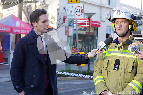 Image of Superintendent Paul Jonstone updating media on fire and explosio