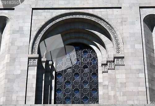 Image of Beautiful window with decorative glass and steel bars