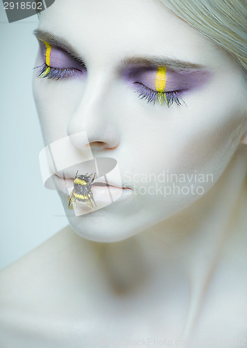 Image of Bumblebee: model with creative make-up and bug on her lips