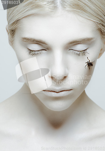 Image of Hibernation and sleep: girl with closed eyes and insect 