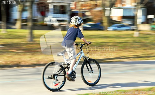 Image of Boy riding a bike