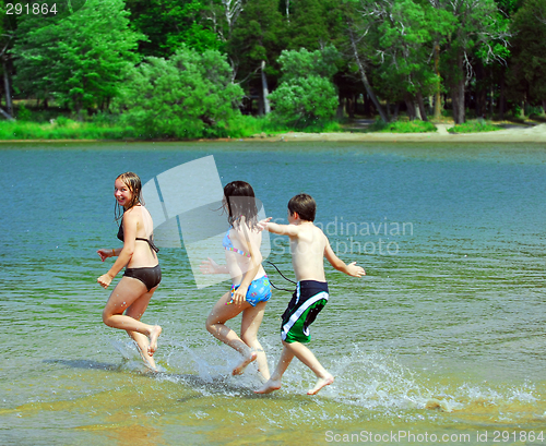 Image of Children running into water